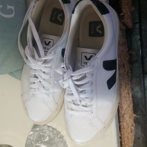 Veja white with black logo.